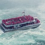 white-boat-with-passengers